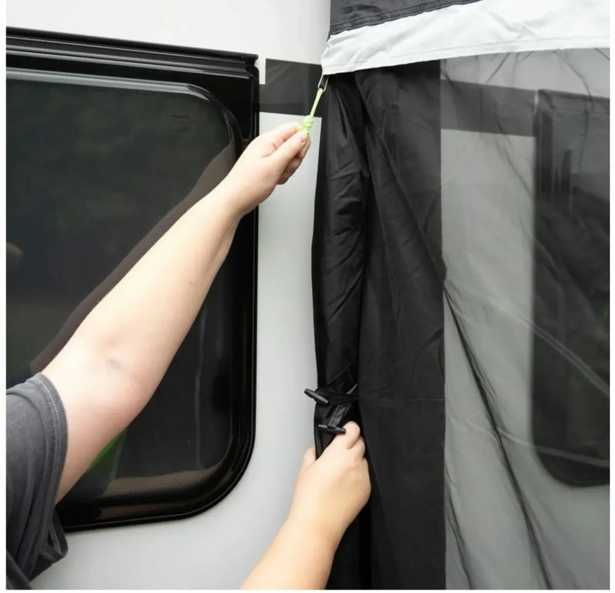 Connecting zip shown with two hands securing the Baywatch 390 air awning.