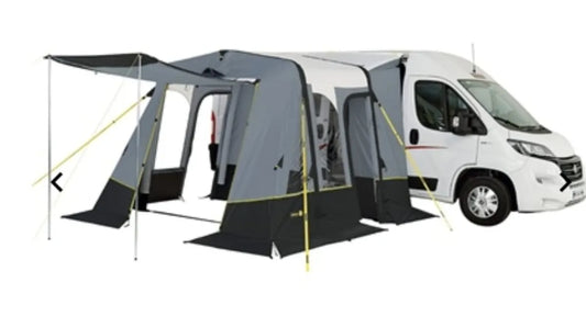 The Trigano Bali inflatable awning is opened and attached to a van.