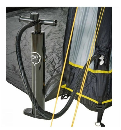 A foot pump is connected to the Trigano Bali inflatable awning.