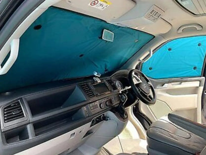 A cabin view of a van, showing the inside view of the PREMIUM REVERSIBLE THERMAL BLINDS.