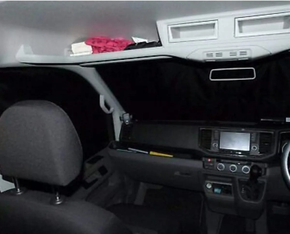 A cabin view of a van, showing the inside view of the PREMIUM REVERSIBLE THERMAL BLINDS.