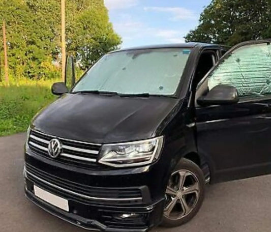 A black van with PREMIUM REVERSIBLE THERMAL BLINDS is shown.