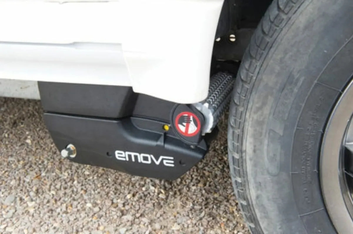 The EM303 caravan mover by Leisurewize is mounted onto a vehicle, showing the gears.