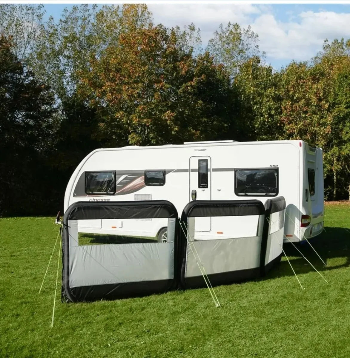 3 Panel Inflatable windbreak outside next to caravan