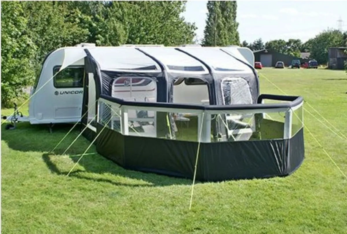 Inflatable windbreak outside next to caravan