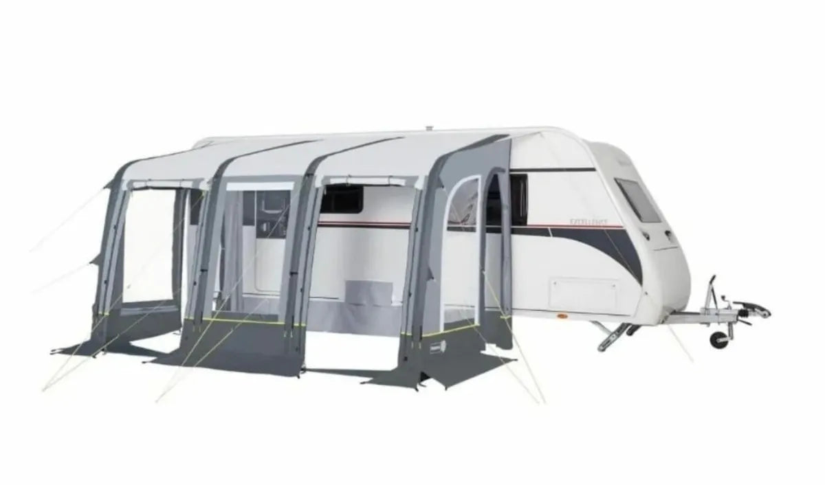 A opened view of the Trigano Aruba Air Awning attached to a caravan, with a white background