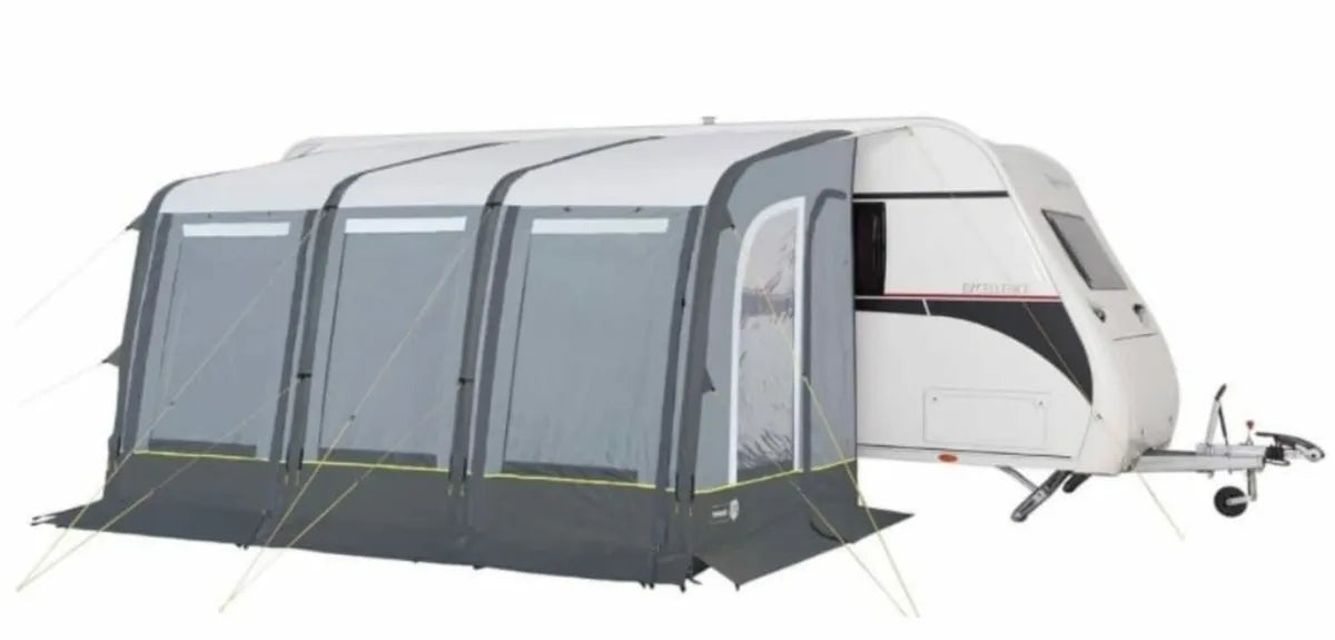 A closed view of the Trigano Aruba Air Awning attached to a caravan, with a white background