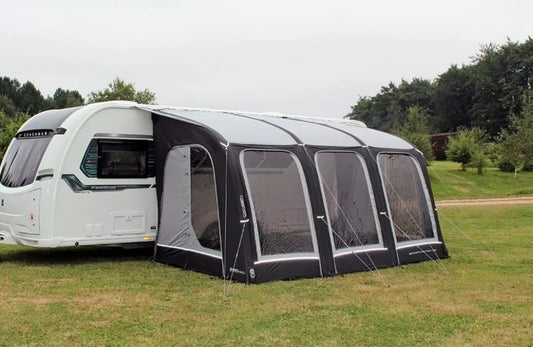 Sportlite Air 400 is pitched up against a caravan.