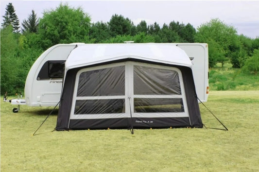 The Eclipse ProX 390 Caravan Air Awning is pitched up and connected to a caravan, front view